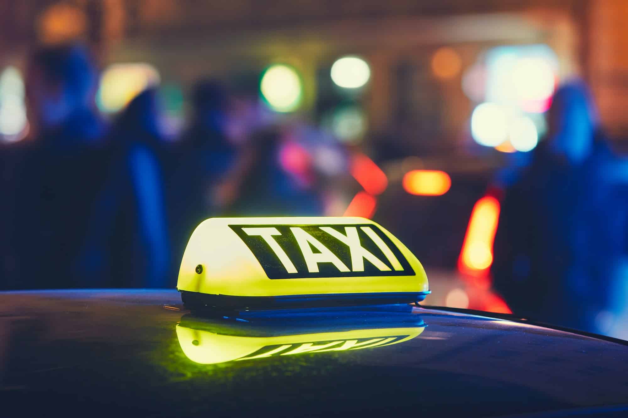 Taxi car on the street at the night